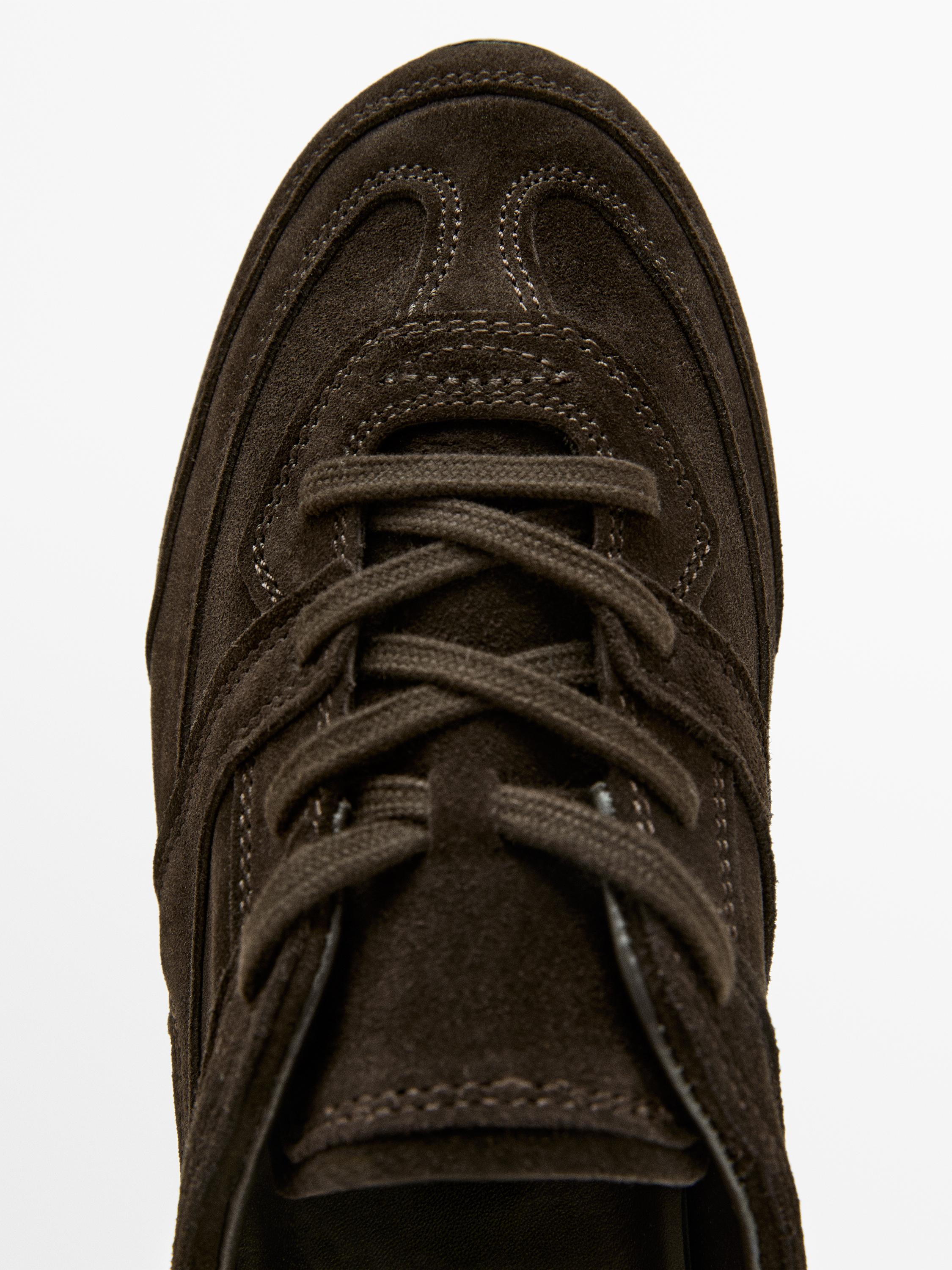 Split leather trainers with piece details